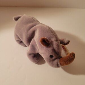 "Spike" the Rhino is a retired Ty Beanie Baby introduced on June 3, 1995, and re